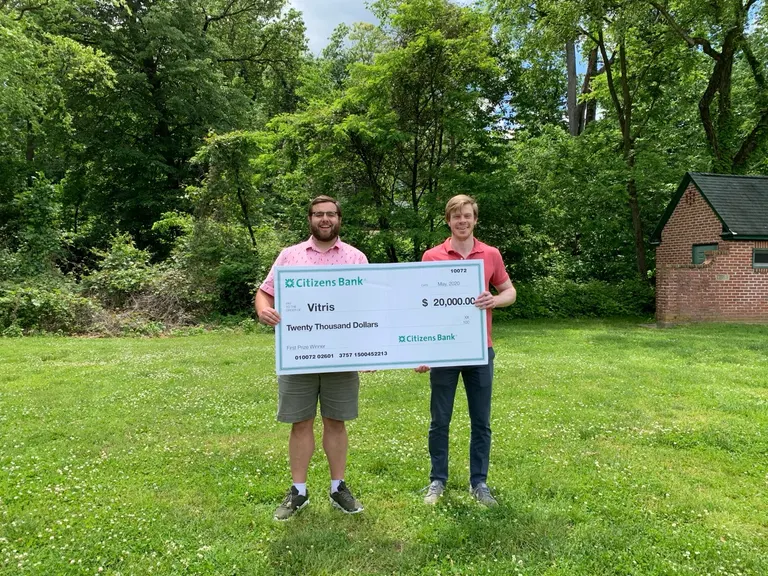 Jack and Cam holding the Vitris Citizens Bank award check at Wall Park in Elkins Park in 2020.